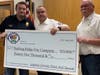 President Greg Taylor & Vice President Don Hart presenting check to Kevin Pescatore of the Basking Ridge Fire Company.