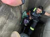 Finderne Volunteer Firefighter in the sewer drain.