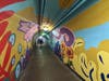 Images from “Vida De el Sol y La Luna” (“Life of the Sun and the Moon”), a mural at the Bound Brook New Jersey Transit station tunnel, created by Raritan Valley Community College art students.