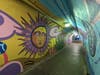 Images from “Vida De el Sol y La Luna” (“Life of the Sun and the Moon”), a mural at the Bound Brook New Jersey Transit station tunnel, created by Raritan Valley Community College art students.