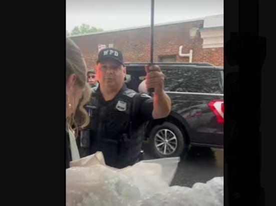 Rachel Harth of Westfield being helped by Officer Donald Perkins.