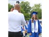 A WHS senior poses for a graduation photograph during the commencement
ceremony for the Class of 2023 on June 21.