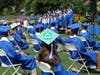 Graduating members of the WHS Choir sing as fellow graduates listen.