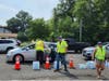 Water bottles being distributed in Bradley Gardens on Saturday. 