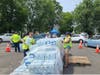 Water bottles being distributed in Bradley Gardens on Saturday. 