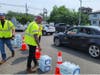 Water bottles being distributed in Bradley Gardens on Saturday. 