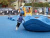 A student enjoys newly installed playground equipment at the Lincoln School Early Childhood Center.