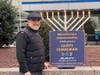 Eli Kramer with menorah dedication.