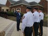 Lieutenant Kevin Lamey saluting Chief John Mitzak.