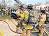 Firefighters responding to a fire at 54 Dorchester Court in Hillsborough on Feb. 10.