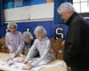 Westfield Public Schools Superintendent Dr. Raymond González looks on as Wilson 3rd graders sort bagged meals as part of a “Rise Against Hunger” event during Community Service Week.