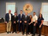 Administrator James Gildea, Firefighter Lestarchick, Firefighter Gyory, Firefighter Eagan, Acting Mayor Dawn Mackey, Chief Michael Duelks, and Assistant Administrator Heather Re-Ferratti.