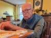Fugate playing dominos with a client.
