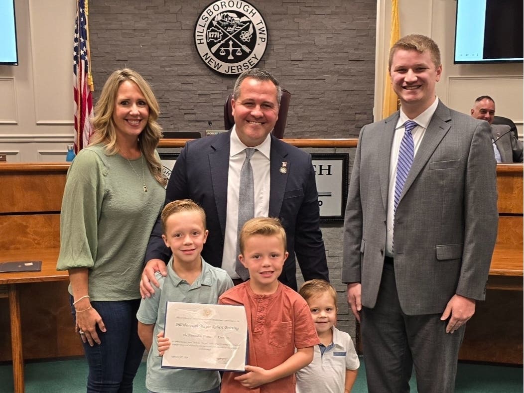 Mayor Robert Britting, Jr. and his family, and Andrew Shipley, an aide to Congressman Tom Kean.