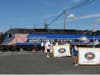 NJT's specially wrapped "Salute to the Armed Forces" passed through the Thompson Street grade crossing to cause a momentary halt to the parade.