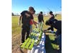 Dashiel Workman paints benches.