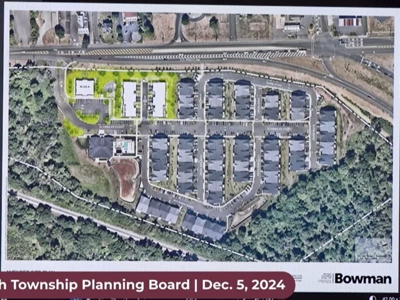 An aerial view of the Hillmont project with the proposed changes highlighted in green.