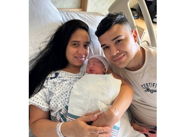 Parents Erika Olivo Chirinos and Deyson Guerra with their baby boy Matthew.