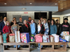 Students and staff involved in the TOPS Program at SCVTHS with some of the toys they collected for children at Agape House.