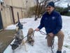 Somerset Regional Animal Shelter Director Brian Bradshaw with two of the rescued Huskies.