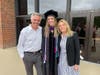 Emma Phillips with her parents.