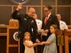 Sgt. Michael Leight with Council Vice President Filipe Pedroso and Leight's daughters.