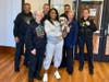 Koko with her Texas owners and the Clark Police Department.