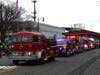 Country Hills FD’s restored 1963 Mack pumper leads their apparatus down Main Street.