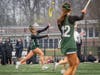 Camryn Ireland, junior #21, passes with speed to maintain possession.