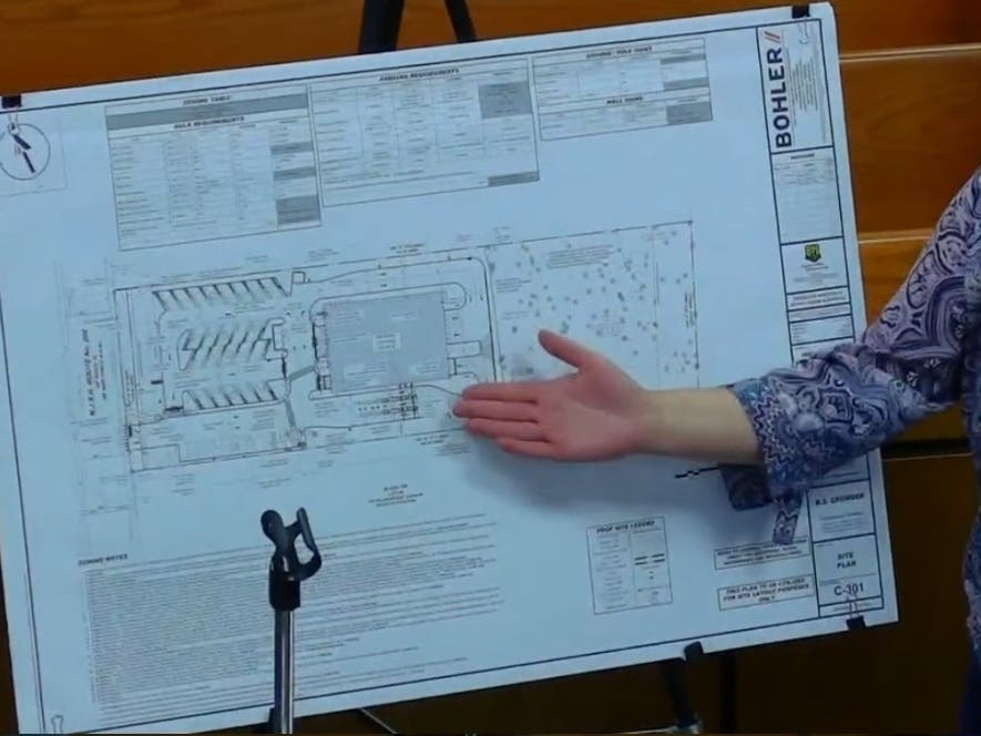 Judy Knob, vice president of development and construction for Spotless Brands, is presenting the car wash plan.