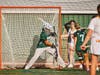 Goalie Ryan Broadhurst, senior #32, reacts with speed to make the save.