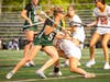 Lauren Swan, sophomore #5, pushes past a Voorhees defender to score.