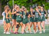 Lexi Hansen, freshman #29, celebrates her 100th draw control on the field.
