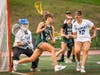 Camryn Ireland, junior #21, drives around the cage and whips the ball past the goalie to score.