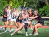 Emily Green, sophomore #19, pivots sharply to avoid a double-team and maintains possession.