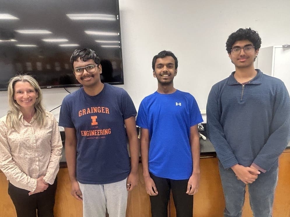Shiven Das and Saharsh Bangaru, both juniors at Bridgewater-Raritan High School, and senior Suyash Gupta, with Dr. Cheryl Pieroni, the science coordinator and advisor to the Biology and Chemistry Olympiad teams at Bridgewater-Raritan High School.