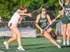 Emily Green, sophomore #19, moves with agility and speed to dodge a Bernards defender and carry the ball into Ridge's attacking end.