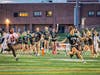 The Ridge sideline erupts as Jojo Venable, senior #3, races to the end zone on a 25-yard interception return in the fourth quarter.