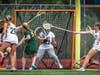 Senior goalie Rylan Broadhurst #32, makes the save after Montgomery breaks through Ridge's defenders.