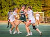 Gia Luzzi, freshman #16, breaks past Bernards' defenders to take a shot at the cage.