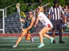 Lauren Swan, sophomore #5, moves with agility past a Bernards defender to carry the ball into Ridge's attacking end.