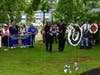 Two members of BGVFC present the memorial wreath at the ceremony after the parade's conclusion.