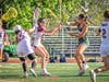 Kate Haviland, junior #8, rips the ball past the Wayne Hills defense and finds the back of the cage.
