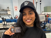 Priya Tunuguntla of Branchburg, a student in the Graphic Communications program at Somerset County Vocational and Technical High School, with some of the items she designed for Paolillo Welding of Hillsborough.