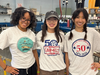 Somerset County Vocational and Technical High School Graphic Communications students Chloe Upton of Watchung, Lian Salas of Bridgewater, and Emma Pham of Millington showing off their designs for Shade Tree Garage. 