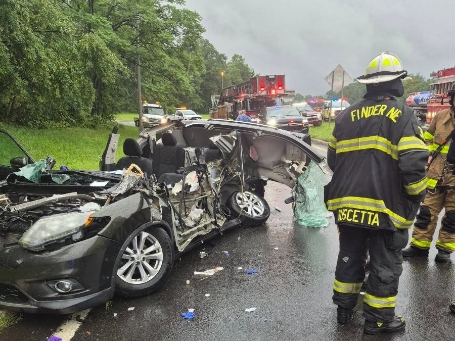 Volunteer firefighters rescued a trapped driver who was later taken to a hospital with critical injuries following a crash with a tractor-trailer on Interstate 287.