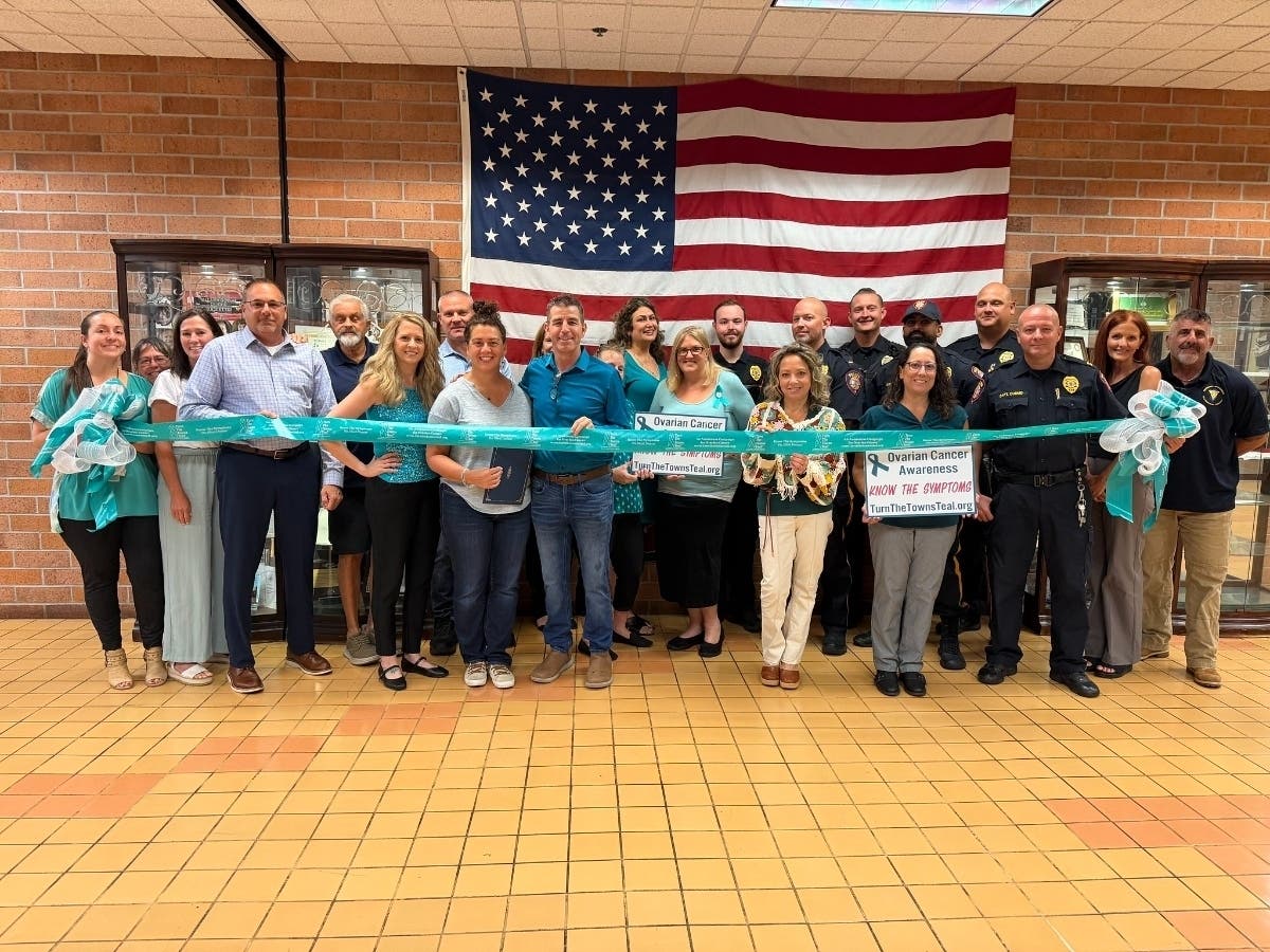 Mayor Catherine Payne joined township staff, members of the Hillsborough Police Department, Susyn Timko and Jim Finkel at the municipal building on Wednesday to tie teal ribbons in observance of Ovarian Cancer Awareness Month.