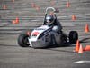 A member of UIC’s chapter of the Society of Automotive Engineers (SAE) Formula team drives the student-built race car to victory on Oct. 29 during Lawrence Technological University’s annual autumn Grand Prix in Southfield, Michigan.