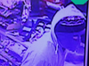 The armed robber was wearing a mask, a gray hooded sweatshirt and black sweatpants, police say.
