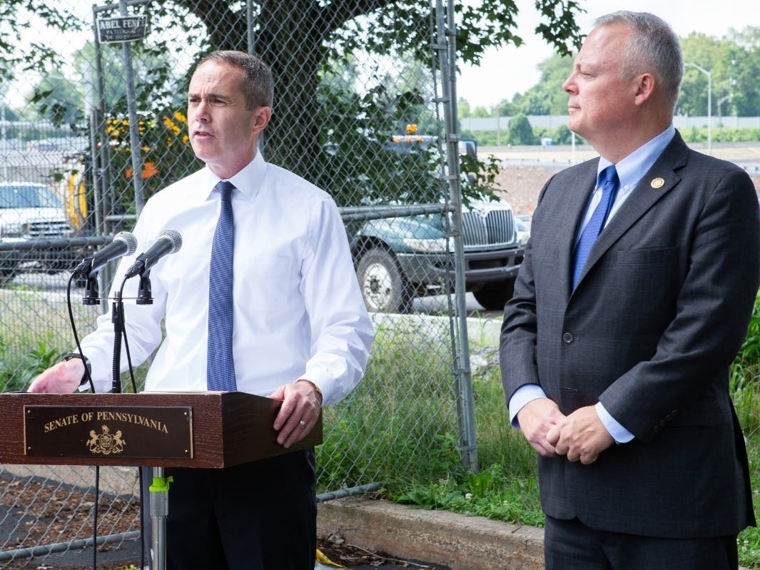 State Sen. Steve Santarsiero, left, and Rep. Perry Warren speak near the Scudder Falls Bridge on Friday.